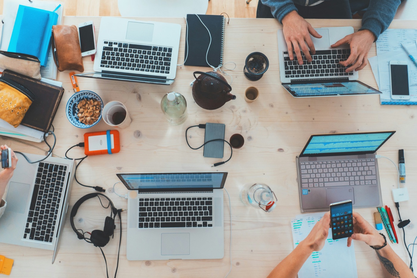 Analysts reviewing digital records and transaction evidence at a shared workspace